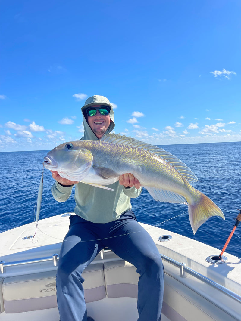 Angler holding a golden tilefish on a boat off Jupiter, Florida