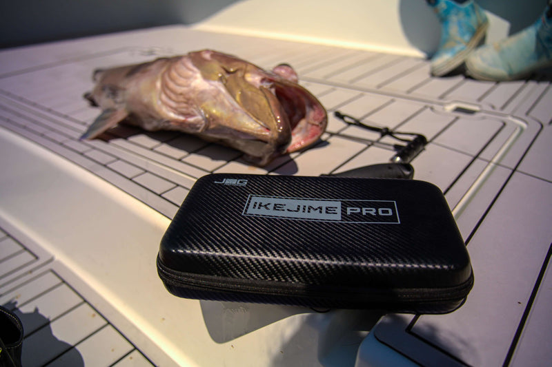 IKEJIME PRO kit case on a boat deck with a freshly caught grouper behind it