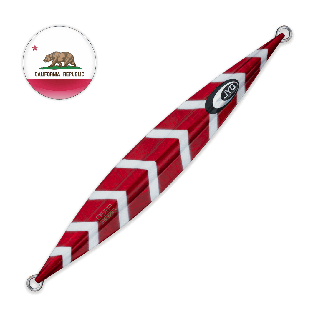 Unrigged slow pitch jig in high-gloss red with white geometric accents, center-weighted and symmetrical for controlled vertical action