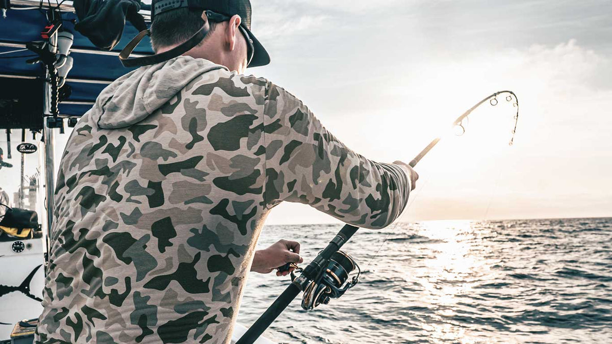 Angler slow pitch jigging with JYG Pro Fishing rod offshore