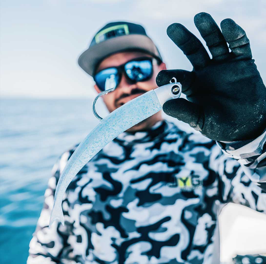 Angler holding SWYM swimbait – JYG Pro Fishing soft baits