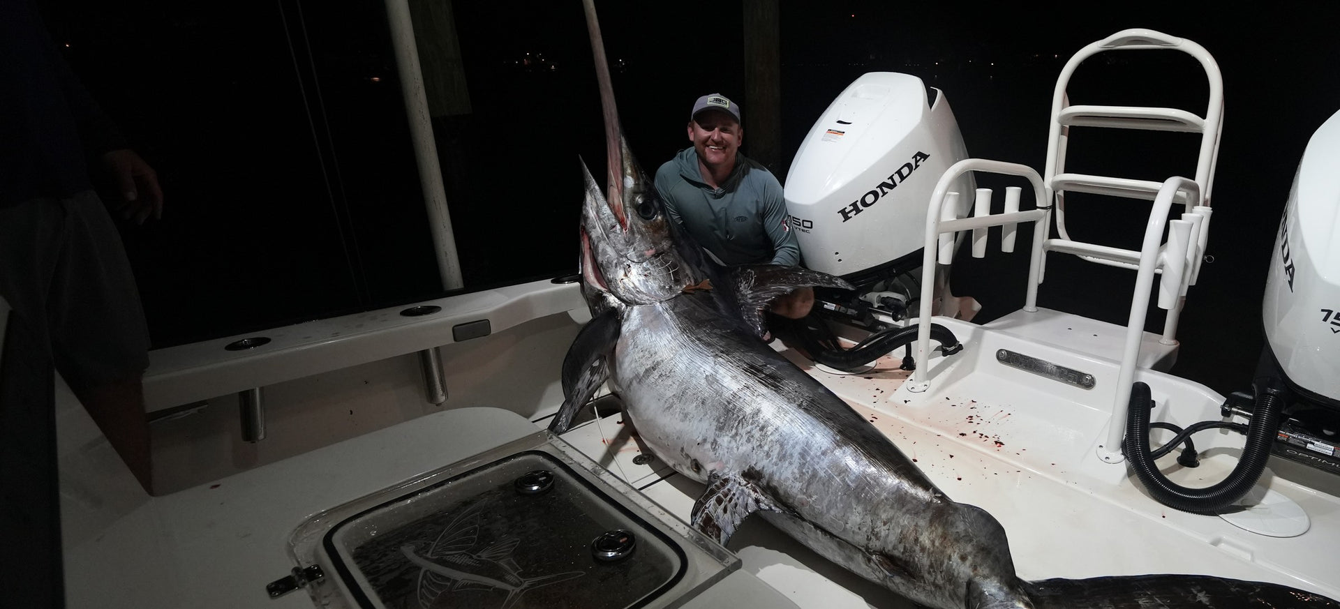 Swordfish landed at night on a Shore Pro rigged center console