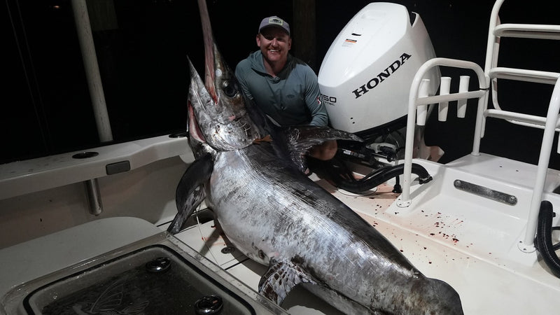 Swordfish landed at night on a Shore Pro rigged center console